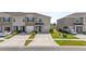 Charming townhome featuring a one-car garage, neutral-toned exterior, and well-maintained landscaping at 2302 Tay Wes Dr, St Cloud, FL 34771