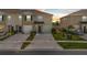 Charming townhome featuring a one-car garage, neutral-toned exterior, and well-maintained landscaping at 2302 Tay Wes Dr, St Cloud, FL 34771