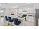 Bright kitchen with island, stainless appliances, ample counter space, and bar seating at 2302 Tay Wes Dr, St Cloud, FL 34771