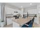 Well-lit kitchen with stainless steel appliances, ample cabinets, and breakfast bar at 2302 Tay Wes Dr, St Cloud, FL 34771