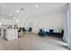 Spacious living area with tile floors and views to the kitchen, dining area and patio at 2302 Tay Wes Dr, St Cloud, FL 34771