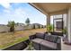 A covered outdoor patio setting featuring outdoor seating and view to the backyard at 2302 Tay Wes Dr, St Cloud, FL 34771