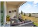 A covered outdoor patio setting featuring outdoor seating and view to the backyard at 2302 Tay Wes Dr, St Cloud, FL 34771