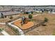 A wood-chip community playground features slides, swings, and secure fencing at 2302 Tay Wes Dr, St Cloud, FL 34771