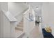 Welcoming staircase and hallway with stylish bench, leading to the living spaces at 2302 Tay Wes Dr, St Cloud, FL 34771