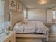 Comfortable bedroom featuring a decorative headboard, bedside tables, and lots of natural light at 2310 Raven Ridge Rd, Minneola, FL 34715