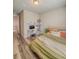Bedroom featuring a bed with orange pillows and a modern-looking desk at 2310 Raven Ridge Rd, Minneola, FL 34715