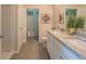 Bathroom with double sinks, granite counters, and a walk-in shower at 248 Cheshire Ct, Kissimmee, FL 34758