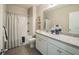 Clean bathroom featuring a vanity with granite counters and shower-tub combo at 248 Cheshire Ct, Kissimmee, FL 34758