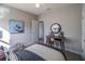 Cozy bedroom with a ceiling fan, desk area, and calming artwork on the wall at 248 Cheshire Ct, Kissimmee, FL 34758