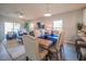 Open concept living and dining area with modern decor, tile floors and lots of natural light at 248 Cheshire Ct, Kissimmee, FL 34758