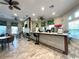 A clean bar area featuring counter seating and several ceiling fans at 2788 Sun Key Pl, Kissimmee, FL 34747