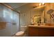 Practical bathroom with a vanity, frameless glass shower, and a toilet at 2788 Sun Key Pl, Kissimmee, FL 34747