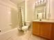 Well-maintained bathroom featuring a shower-tub combo and a single vanity at 2788 Sun Key Pl, Kissimmee, FL 34747