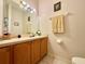 Clean bathroom featuring a vanity with a sink, a large mirror, and neutral-toned walls at 2788 Sun Key Pl, Kissimmee, FL 34747