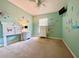 Bright bedroom featuring a ceiling fan and unique customized wall decor at 2788 Sun Key Pl, Kissimmee, FL 34747