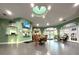 A spacious lobby featuring tiled floors, natural light, and comfortable seating at 2788 Sun Key Pl, Kissimmee, FL 34747
