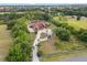 This aerial view showcases home and acreage, highlighted by a property line at 2841 S Lloyd Ln, Kissimmee, FL 34744