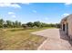 Backyard featuring a pond, gazebo, patio, and lush landscaping, perfect for outdoor enjoyment at 2841 S Lloyd Ln, Kissimmee, FL 34744