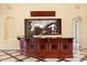 The wet bar features star details, granite countertops, and a decorative fish tank at 2841 S Lloyd Ln, Kissimmee, FL 34744