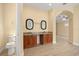 Bathroom with dual vanities, granite countertops, and tile flooring at 2841 S Lloyd Ln, Kissimmee, FL 34744