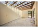 Unfinished bonus room featuring a wall of windows and a door to the backyard at 2841 S Lloyd Ln, Kissimmee, FL 34744