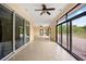 Large Florida room with tile floors, many windows and sliding glass doors at 2841 S Lloyd Ln, Kissimmee, FL 34744