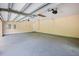 Spacious garage with concrete flooring and an automatic garage door opener at 2841 S Lloyd Ln, Kissimmee, FL 34744