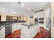 Gourmet kitchen boasts granite counters, a center island, and stainless steel appliances at 2841 S Lloyd Ln, Kissimmee, FL 34744
