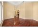 Bright living area featuring hardwood floors, neutral walls, and large windows with architectural columns at 2841 S Lloyd Ln, Kissimmee, FL 34744
