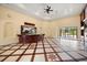 Spacious living area boasts a large wet bar, unique tile flooring, and access to the lanai at 2841 S Lloyd Ln, Kissimmee, FL 34744