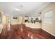Open concept living area with hardwood floors and open kitchen with modern appliances at 2841 S Lloyd Ln, Kissimmee, FL 34744