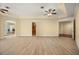 Spacious main bedroom with wood-look tile flooring and a tray ceiling at 2841 S Lloyd Ln, Kissimmee, FL 34744