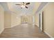 Large main bedroom featuring a double ceiling fan and access to the backyard at 2841 S Lloyd Ln, Kissimmee, FL 34744