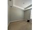 Clean, unfurnished bedroom with hardwood floors, tray ceiling, and natural light, ready for personal touches at 2920 Agostino Ter, Kissimmee, FL 34746
