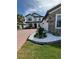 Elegant two-story home featuring a brick driveway, attached two-car garage and beautifully landscaped front yard at 2920 Agostino Ter, Kissimmee, FL 34746