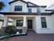 Charming two-story home with a covered front porch and well-maintained landscaping at 2920 Agostino Ter, Kissimmee, FL 34746