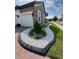 Beautiful curb appeal featuring manicured landscaping with rock border, grass, and a two-car garage at 2920 Agostino Ter, Kissimmee, FL 34746