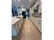 Bright kitchen features stainless steel appliances, light wood flooring, and ample counter space at 2920 Agostino Ter, Kissimmee, FL 34746