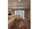 Living room features sliding doors and a large sectional sofa at 2920 Agostino Ter, Kissimmee, FL 34746