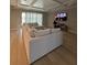 Spacious living room with modern ceiling, hardwood floors, and a large sectional sofa at 2920 Agostino Ter, Kissimmee, FL 34746