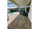Covered patio featuring comfortable outdoor seating next to a sparkling pool, perfect for entertaining or relaxing at 2920 Agostino Ter, Kissimmee, FL 34746