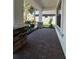 Covered patio area with brick flooring, decorative stone pillars, and landscaping at 2920 Agostino Ter, Kissimmee, FL 34746