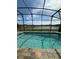 The pool offers a refreshing oasis in the screened enclosure overlooking a well-manicured lawn and pond at 2920 Agostino Ter, Kissimmee, FL 34746