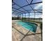 Sparkling in-ground pool set within a screened lanai, ideal for year-round swimming and leisure at 2920 Agostino Ter, Kissimmee, FL 34746