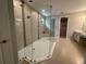 A modern glass shower with dual shower heads and decorative tile accents creating an elegant and functional design at 2920 Agostino Ter, Kissimmee, FL 34746