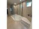 A modern glass shower with dual shower heads and decorative tile accents adding elegance to the design at 2920 Agostino Ter, Kissimmee, FL 34746