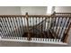 Interior view of the staircase with dark wood and iron spindles at 2920 Agostino Ter, Kissimmee, FL 34746