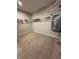 Spacious walk-in closet with ample shelving and hanging space, providing organized storage solutions at 2920 Agostino Ter, Kissimmee, FL 34746