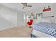 Bedroom features include fun cartoon accents, carpet and a ceiling fan at 2985 Banana Palm Dr, Kissimmee, FL 34747